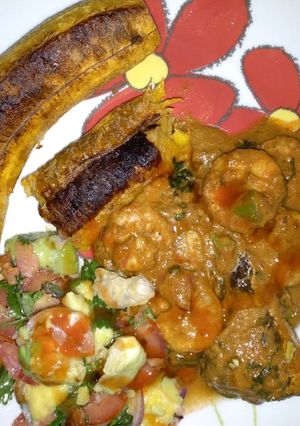 A picture of Grilled tembo bananas prawns in coconut sauce.