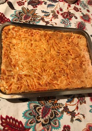 Una foto de Fainá de queso con jamón y ajo