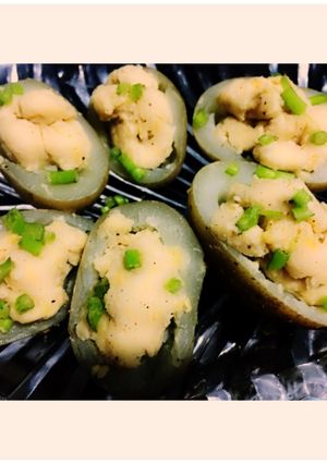A picture of Hummus in delived potato.