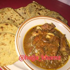 A picture of No yeast pita bread and assorted meat pepper soup.