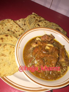A picture of No yeast pita bread and assorted meat pepper soup.