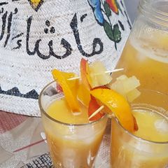 A picture of Pineapple, orange and nectarines refreshment.