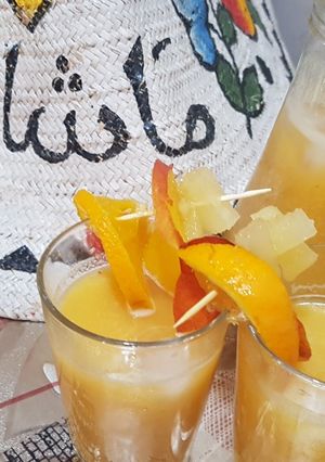 A picture of Pineapple, orange and nectarines refreshment.