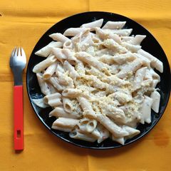 A picture of Penne Pasta in White Sauce.