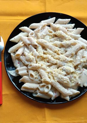 A picture of Penne Pasta in White Sauce.