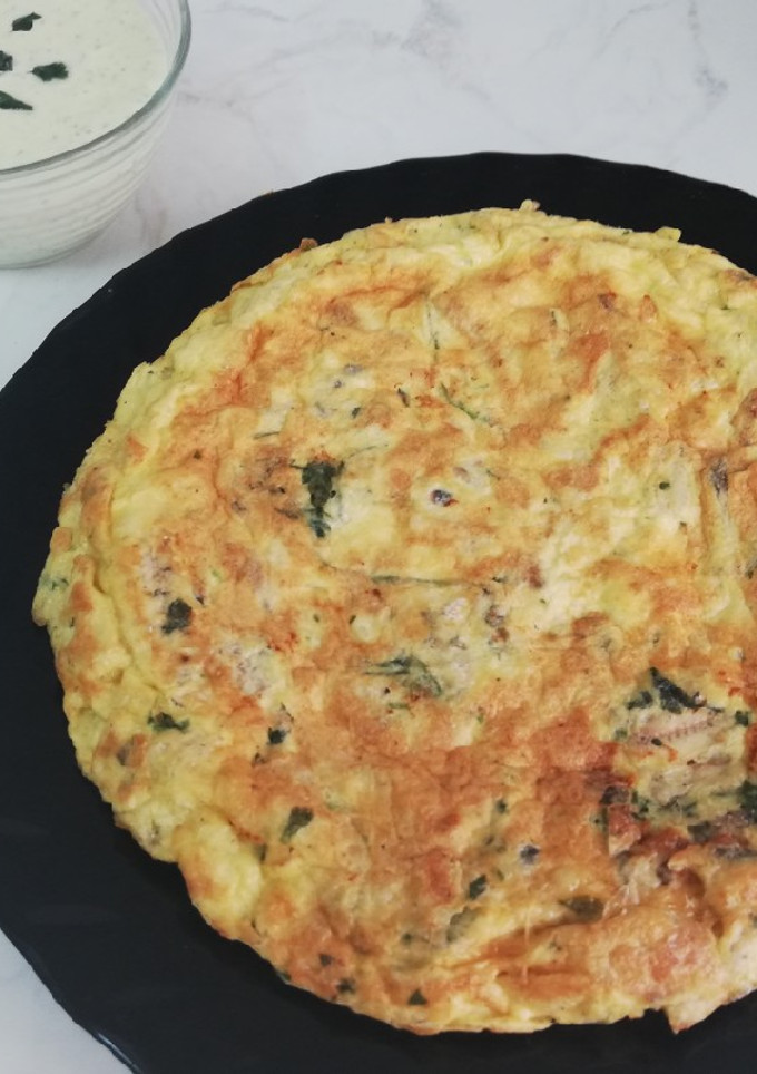 Una foto de Tortilla de boquerones al ajillo