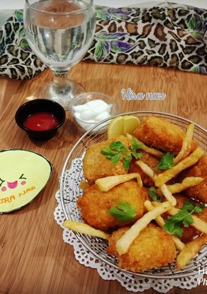 A picture of Chicken Nuggets With French Fries.
