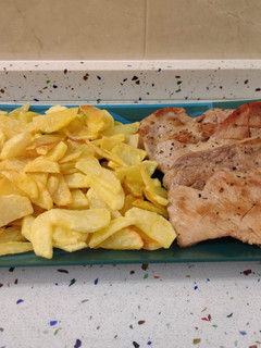 Una foto de Secreto ibérico con patatas fritas