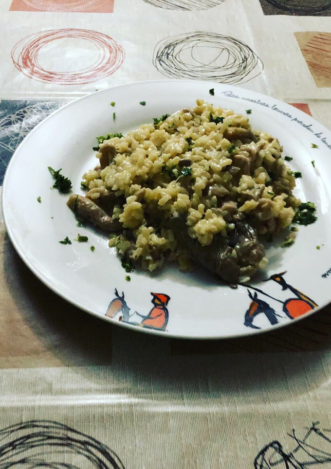 Una foto de Risotto de setas con lomo de dos colores