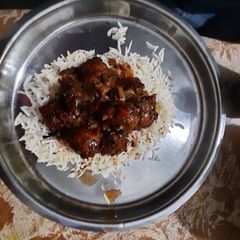 A picture of Veg manchurian with rice.