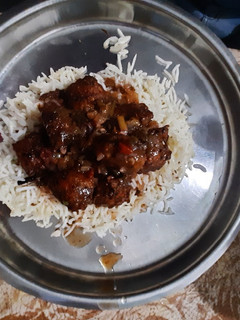 A picture of Veg manchurian with rice.