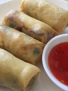 A picture of Springroll with sweet and chilli sauce.