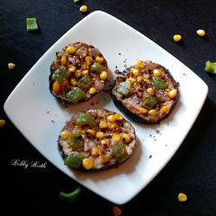 A picture of Eggplant disc mini pan pizza.