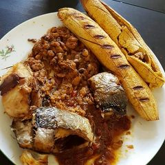 A picture of Grilled plantain,fish and honey beans.