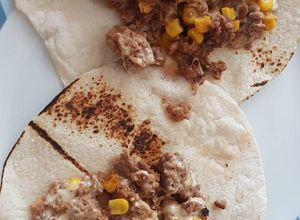 Una foto de Picadillo con chipotle elote y queso