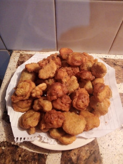 Una foto de Buñuelos de Rúcula y morrón
