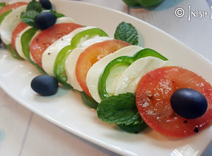 A picture of Caprese salad with Capsicum.