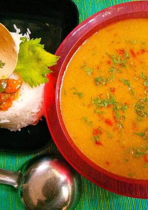 A picture of Oats and orange rasam.