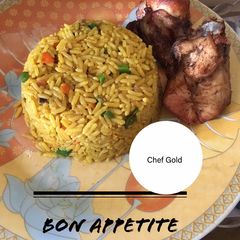 A picture of Fried rice and Chicken.