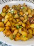 Pommes de terre sautées aux oignons nouveaux