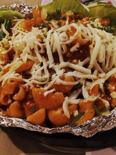 A picture of Sizzling pasta in red sauce.