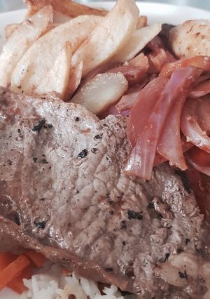 Una foto de Churrasco encebollado