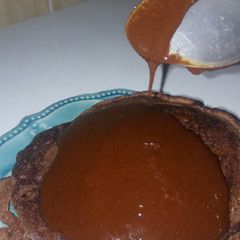Chocolate pancakes topped with homemade chocolate sauce A picture of Chocolate pancakes topped with homemade chocolate sauce.