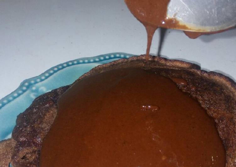 Chocolate pancakes topped with homemade chocolate sauce