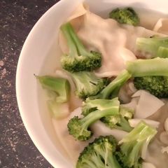 A picture of Brocolli and Dumpling Soup.