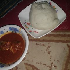 A picture of Pounded yam and fresh fish soup.