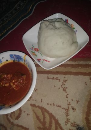 A picture of Pounded yam and fresh fish soup.
