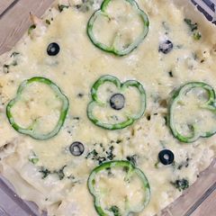 A picture of Alfredo chicken lasagna.