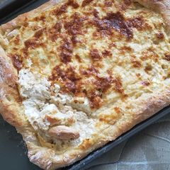 A picture of Chicken alfredo bread boat.