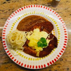 A picture of Chicken Parmesan with Arrabbiata sauce.
