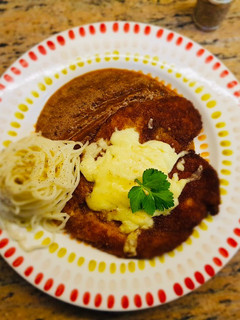 A picture of Chicken Parmesan with Arrabbiata sauce.