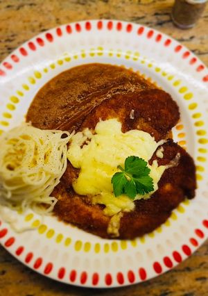 A picture of Chicken Parmesan with Arrabbiata sauce.