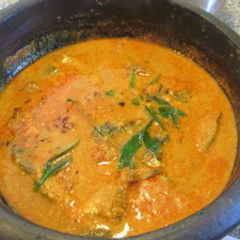 A picture of Kerala Style Fish Curry using green mangoes or kodampuli.