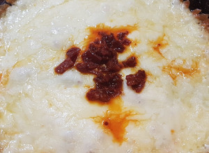 Una foto de Queso fundido con chorizo