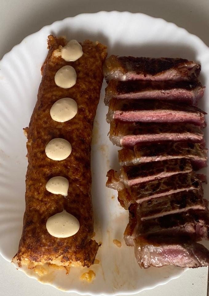 Una foto de Arroz socarrat con chuletón