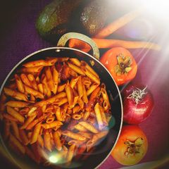 A picture of Red sauce penne pasta.