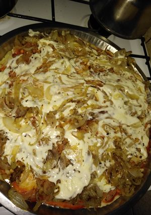 Una foto de Pizza de cebollas