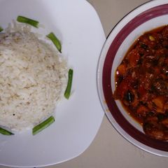 A picture of Gizzard sauce with local rice.