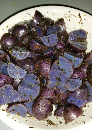 A picture of Purple Potatoes with Garlic, Herbs, and Parsley.