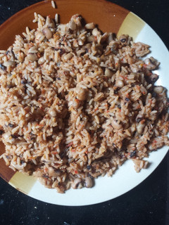 A picture of Jollof rice and beans.