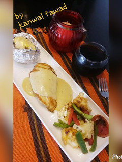 A picture of Chicken Steak with white sauce.