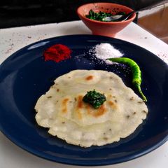 Rice flour chapati with green chutney A picture of Rice flour chapati with green chutney.