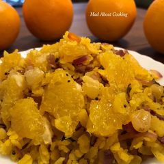 A picture of Orangey Poha – Vitamin C Rich Breakfast Recipe – Poha With A Twist.