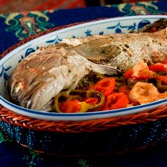 A picture of Oven baked fish with chili - samkeh harra.