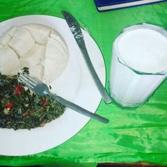 Ugali with mboga kienyeji and mala A picture of Ugali with mboga kienyeji and mala.