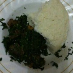 A picture of Ugari and green vegetables for two.